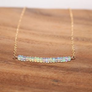 Welo Opal Bar Necklace, Welo Ethiopian Opal Jewelry, October Birthstone, Minimalist, Gemstone Necklace | Natural genuine Opal necklaces. Buy crystal jewelry, handmade handcrafted artisan jewelry for women.  Unique handmade gift ideas. #jewelry #beadednecklaces #beadedjewelry #gift #shopping #handmadejewelry #fashion #style #product #necklaces #affiliate #ad