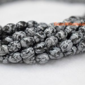 Shop Snowflake Obsidian Bead Shapes! 15.5" 6x12mm snowflake obsidian rice beads, semi precious stone,black grey gemstone beads, 6x12mm barrel beads | Natural genuine other-shape Snowflake Obsidian beads for beading and jewelry making.  #jewelry #beads #beadedjewelry #diyjewelry #jewelrymaking #beadstore #beading #affiliate #ad