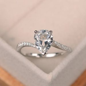 Shop Topaz Rings! Natural white topaz ring, pear shaped engagement ring silver, gemstone ring | Natural genuine Topaz rings, simple unique alternative gemstone engagement rings. #rings #jewelry #bridal #wedding #jewelryaccessories #engagementrings #weddingideas #affiliate #ad