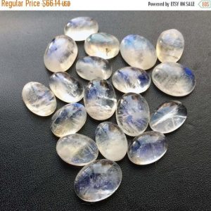 Shop Moonstone Bead Shapes! 14-16mm Rainbow Moonstone Oval Cabochons, Rainbow Moonstone Oval Gems, Moonstone Loose Gemstones For Jewelry (4Pcs To 16Pcs Options) | Natural genuine other-shape Moonstone beads for beading and jewelry making.  #jewelry #beads #beadedjewelry #diyjewelry #jewelrymaking #beadstore #beading #affiliate #ad