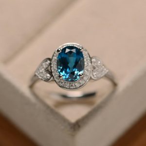 Oval shape London blue topaz engagement ring, sterling silver halo ring with double heart,November birthstone | Natural genuine Gemstone rings, simple unique alternative gemstone engagement rings. #rings #jewelry #bridal #wedding #jewelryaccessories #engagementrings #weddingideas #affiliate #ad
