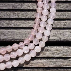 Shop Rose Quartz Round Beads! Natural Rose Quartz 7-8mm round beads (ETB00155) | Natural genuine round Rose Quartz beads for beading and jewelry making.  #jewelry #beads #beadedjewelry #diyjewelry #jewelrymaking #beadstore #beading #affiliate #ad