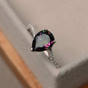 Shop Topaz Rings! Mystic topaz ring, pear cut engagement ring, sterling silver ring, rainbow topaz ring, gemstone jewelry | Natural genuine Topaz rings, simple unique alternative gemstone engagement rings. #rings #jewelry #bridal #wedding #jewelryaccessories #engagementrings #weddingideas #affiliate #ad