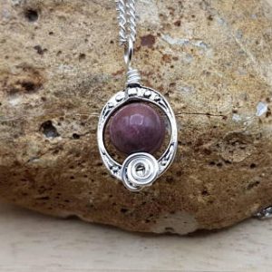 Shop Rhodonite Necklaces! Pink Rhodonite pendant necklace. Reiki jewelry uk. Taurus pendant. Silver plated Wire wrap pendant. Oval frame necklaces for women. | Natural genuine Rhodonite necklaces. Buy crystal jewelry, handmade handcrafted artisan jewelry for women.  Unique handmade gift ideas. #jewelry #beadednecklaces #beadedjewelry #gift #shopping #handmadejewelry #fashion #style #product #necklaces #affiliate #ad