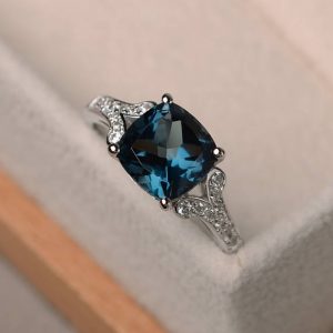 Shop Topaz Jewelry! London blue topaz ring, cushion cut wedding engagement ring, sterling silver ring,blue gemstone ring | Natural genuine Topaz jewelry. Buy handcrafted artisan wedding jewelry.  Unique handmade bridal jewelry gift ideas. #jewelry #beadedjewelry #gift #crystaljewelry #shopping #handmadejewelry #wedding #bridal #jewelry #affiliate #ad