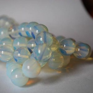 Shop Moonstone Round Beads! High Quality Opalite Moonstone Round Beads – 4mm, 6mm, 8mm, 10mm sizes – 15.5" strand | Natural genuine round Moonstone beads for beading and jewelry making.  #jewelry #beads #beadedjewelry #diyjewelry #jewelrymaking #beadstore #beading #affiliate #ad