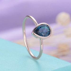 London Blue Topaz engagement ring rose gold Vintage Art deco Wedding Bridal Simple Pear Cut Stacking Tear Drop Promise Anniversary ring | Natural genuine Gemstone rings, simple unique alternative gemstone engagement rings. #rings #jewelry #bridal #wedding #jewelryaccessories #engagementrings #weddingideas #affiliate #ad