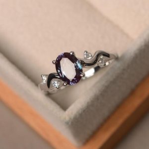 Shop Alexandrite Rings! lab alexandrite ring, engagement ring, oval cut, color changing gemstone ring ,sterling silver ring, June birthstone | Natural genuine Alexandrite rings, simple unique alternative gemstone engagement rings. #rings #jewelry #bridal #wedding #jewelryaccessories #engagementrings #weddingideas #affiliate #ad