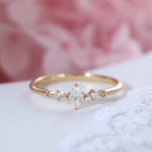 Shop Dainty Jewelry! Marquise cut diamond engagement ring yellow gold Simple Three stone Cluster engagement ring Bridal Dainty wedding Promise Anniversary ring | Natural genuine Gemstone jewelry. Buy handcrafted artisan wedding jewelry.  Unique handmade bridal jewelry gift ideas. #jewelry #beadedjewelry #gift #crystaljewelry #shopping #handmadejewelry #wedding #bridal #jewelry #affiliate #ad
