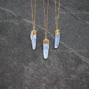 Shop Kyanite Jewelry! Gold Kyanite Necklace, Kyanite Necklace, Raw Kyanite Pendant, Blue Kyanite Pendant, Kyanite Jewelry, Blue Kyanite, Natural Kyanite | Natural genuine Kyanite jewelry. Buy crystal jewelry, handmade handcrafted artisan jewelry for women.  Unique handmade gift ideas. #jewelry #beadedjewelry #beadedjewelry #gift #shopping #handmadejewelry #fashion #style #product #jewelry #affiliate #ad