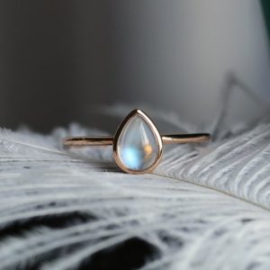 Pear Shaped Moonstone Engagement Ring Rose gold bezel set Simple wedding bridal Art deco  ring Birthstone Modern Promise Anniversary ring | Natural genuine Gemstone rings, simple unique alternative gemstone engagement rings. #rings #jewelry #bridal #wedding #jewelryaccessories #engagementrings #weddingideas #affiliate #ad