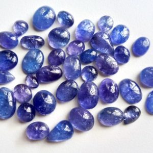 Shop Tanzanite Cabochons! 8-15mm Tanzanite Plain Cabochons, Natural Tanzanite Mix Shape Flat Back Cabochons, Loose Tanzanite Gems For Jewelry (3Pcs To 5Pcs Options) | Natural genuine stones & crystals in various shapes & sizes. Buy raw cut, tumbled, or polished gemstones for making jewelry or crystal healing energy vibration raising reiki stones. #crystals #gemstones #crystalhealing #crystalsandgemstones #energyhealing #affiliate #ad