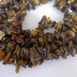 Shop Tiger Eye Chip & Nugget Beads! 5mm To 7mm Tigers Eye Chips, Raw Tigers Eye Beads, Natural Tigers Eye Chips, Tigers Eye For Necklace, 32 Inch (1Strand To 5Strand Options) | Natural genuine chip Tiger Eye beads for beading and jewelry making.  #jewelry #beads #beadedjewelry #diyjewelry #jewelrymaking #beadstore #beading #affiliate #ad