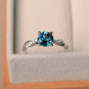 Shop Topaz Rings! Real London blue topaz rings, promise rings, round cut blue gems, silver rings | Natural genuine Topaz rings, simple unique handcrafted gemstone rings. #rings #jewelry #shopping #gift #handmade #fashion #style #affiliate #ad