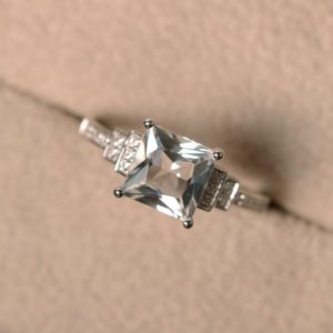 Shop Topaz Rings! White topaz ring, anniversary ring, princess cut ring, engagement ring | Natural genuine Topaz rings, simple unique alternative gemstone engagement rings. #rings #jewelry #bridal #wedding #jewelryaccessories #engagementrings #weddingideas #affiliate #ad