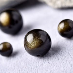 10pcs Grade AA Natural Gold Obsidian Beads, Smooth Round (GO12) | Natural genuine round Golden Obsidian beads for beading and jewelry making.  #jewelry #beads #beadedjewelry #diyjewelry #jewelrymaking #beadstore #beading #affiliate #ad