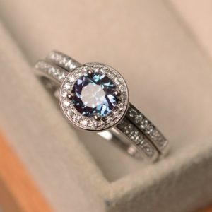 Lab alexandrite ring, round cut halo ring, color-changing gemstone, engagement ring with a band, promising ring for women | Natural genuine Gemstone rings, simple unique alternative gemstone engagement rings. #rings #jewelry #bridal #wedding #jewelryaccessories #engagementrings #weddingideas #affiliate #ad