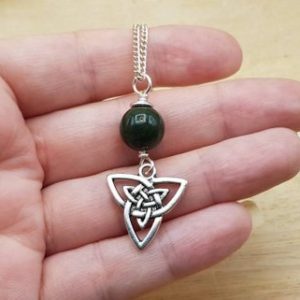 Shop Bloodstone Pendants! Bloodstone Celtic knot triquetra pendant. March birthstone. Silver plated Green Reiki jewelry uk. 10mm stone | Natural genuine Bloodstone pendants. Buy crystal jewelry, handmade handcrafted artisan jewelry for women.  Unique handmade gift ideas. #jewelry #beadedpendants #beadedjewelry #gift #shopping #handmadejewelry #fashion #style #product #pendants #affiliate #ad
