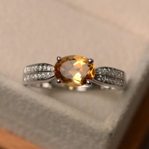 Shop Citrine Engagement Rings! yellow citrine ring, oval cut engagement ring, November birthstone ring, proposal ring for women | Natural genuine Citrine rings, simple unique alternative gemstone engagement rings. #rings #jewelry #bridal #wedding #jewelryaccessories #engagementrings #weddingideas #affiliate #ad
