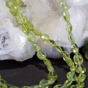 Shop Peridot Bead Shapes! Peridot Faceted Long Drilled Drop Beads 10 In. Full Strand, Green Gemstone, Natural Stone, Semi Precious, August Birthstone, Genuine Peridot | Natural genuine other-shape Peridot beads for beading and jewelry making.  #jewelry #beads #beadedjewelry #diyjewelry #jewelrymaking #beadstore #beading #affiliate #ad