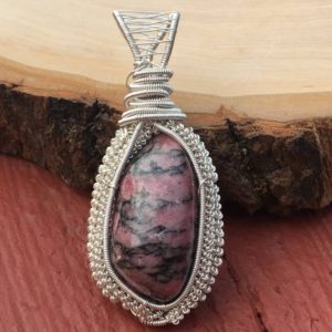 Shop Rhodonite Pendants! Rhodonite wire wrapped pendant, rhodonite pendant, rhodonite jewelry, pink stone wire wrap, heady rhodonite wire wrap, rhodonite necklace | Natural genuine Rhodonite pendants. Buy crystal jewelry, handmade handcrafted artisan jewelry for women.  Unique handmade gift ideas. #jewelry #beadedpendants #beadedjewelry #gift #shopping #handmadejewelry #fashion #style #product #pendants #affiliate #ad