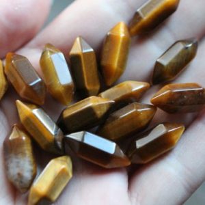 Shop Tiger Eye Points & Wands! Tiger's Eye Small Double Terminated Carved Point M7 | Natural genuine stones & crystals in various shapes & sizes. Buy raw cut, tumbled, or polished gemstones for making jewelry or crystal healing energy vibration raising reiki stones. #crystals #gemstones #crystalhealing #crystalsandgemstones #energyhealing #affiliate #ad