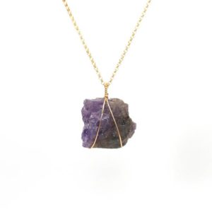 Shop Tanzanite Necklaces! Tanzanite necklace, raw crystal necklace, purpled stone pendant necklace, a wire wrapped raw tanzanite on a 14k gold filled chain | Natural genuine Tanzanite necklaces. Buy crystal jewelry, handmade handcrafted artisan jewelry for women.  Unique handmade gift ideas. #jewelry #beadednecklaces #beadedjewelry #gift #shopping #handmadejewelry #fashion #style #product #necklaces #affiliate #ad