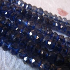 Shop Iolite Faceted Beads! 1/2 Strand – IOLITE Rondelles Beads Gemstone Rondelle / Luxe AAA, 3-3.5 mm / Faceted Water Sapphire, September Birthstone / brides weddings | Natural genuine faceted Iolite beads for beading and jewelry making.  #jewelry #beads #beadedjewelry #diyjewelry #jewelrymaking #beadstore #beading #affiliate #ad