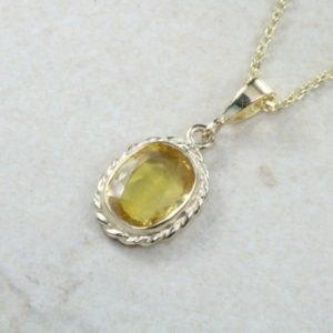 Shop Yellow Sapphire Necklaces! Over 2 carat Oval cut Yellow Sapphire set Gold Necklace | Natural genuine Yellow Sapphire necklaces. Buy crystal jewelry, handmade handcrafted artisan jewelry for women.  Unique handmade gift ideas. #jewelry #beadednecklaces #beadedjewelry #gift #shopping #handmadejewelry #fashion #style #product #necklaces #affiliate #ad
