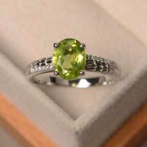 Peridot ring, engagement ring, natural peridot, oval cut peridot ring, green gemstone ring | Natural genuine Array rings, simple unique alternative gemstone engagement rings. #rings #jewelry #bridal #wedding #jewelryaccessories #engagementrings #weddingideas #affiliate #ad