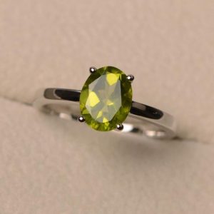 Shop Peridot Rings! Green peridot ring, August birthstone ring, oval cut silver ring, proposal ring for women | Natural genuine Peridot rings, simple unique handcrafted gemstone rings. #rings #jewelry #shopping #gift #handmade #fashion #style #affiliate #ad