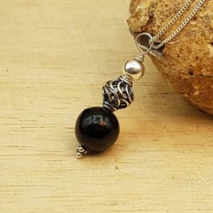 Shop Jet Pendants! Small Black Jet pendant. Reiki jewelry uk. Minimalist Bali silver Wire wrapped pendant. | Natural genuine Jet pendants. Buy crystal jewelry, handmade handcrafted artisan jewelry for women.  Unique handmade gift ideas. #jewelry #beadedpendants #beadedjewelry #gift #shopping #handmadejewelry #fashion #style #product #pendants #affiliate #ad