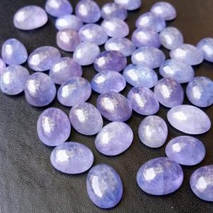 Shop Tanzanite Stones & Crystals! 6x8mm – 7x9mm Tanzanite Plain Cabochons, Natural Tanzanite Oval Flat Back Cabochons, Loose Tanzanite For Jewelry (5Pcs To 10Pcs Options) | Natural genuine stones & crystals in various shapes & sizes. Buy raw cut, tumbled, or polished gemstones for making jewelry or crystal healing energy vibration raising reiki stones. #crystals #gemstones #crystalhealing #crystalsandgemstones #energyhealing #affiliate #ad