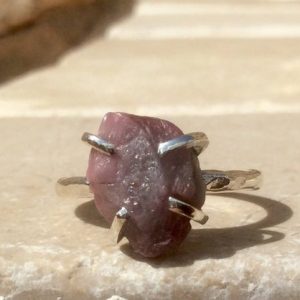 Shop Pink Sapphire Rings! Raw Pink Sapphire Silver Claw Ring, Raw Stone Ring, Gift for Her | Natural genuine Pink Sapphire rings, simple unique handcrafted gemstone rings. #rings #jewelry #shopping #gift #handmade #fashion #style #affiliate #ad