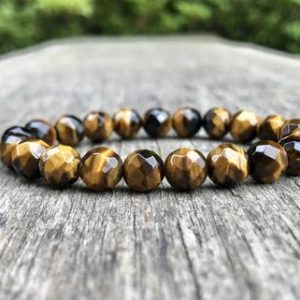 Shop Tiger Eye Bracelets! Faceted Brown Tiger's Eye Bracelet Grade A 8mm Brown Tiger's Eye Beaded Bracelet Jewelry Gift Bracelet Strength And Clarity Bracelet | Natural genuine Tiger Eye bracelets. Buy crystal jewelry, handmade handcrafted artisan jewelry for women.  Unique handmade gift ideas. #jewelry #beadedbracelets #beadedjewelry #gift #shopping #handmadejewelry #fashion #style #product #bracelets #affiliate #ad