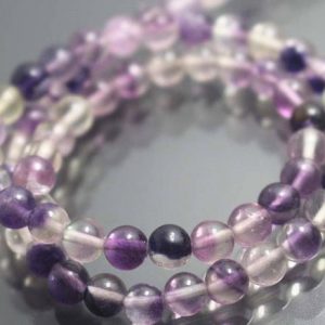 Shop Fluorite Round Beads! 6mm/8mm/10mm/12mm Genuine Purple Fluorite Beads,Smooth and Round Genuine Purple Fluorite Beads,15 inches one starand | Natural genuine round Fluorite beads for beading and jewelry making.  #jewelry #beads #beadedjewelry #diyjewelry #jewelrymaking #beadstore #beading #affiliate #ad