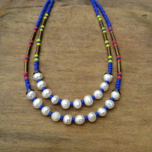 Shop Pearl Necklaces! Colorful Beaded Bohemian Necklace with freshwater pearls, royal blue seed beads, and choice of yellow or orange accents | Natural genuine Pearl necklaces. Buy crystal jewelry, handmade handcrafted artisan jewelry for women.  Unique handmade gift ideas. #jewelry #beadednecklaces #beadedjewelry #gift #shopping #handmadejewelry #fashion #style #product #necklaces #affiliate #ad