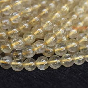 Shop Rutilated Quartz Round Beads! 15.5" 4mm/6mm A Natural golden rutilated quartz round beads, golden color semi-precious stone, gemstone wholesale, natural crystal beads | Natural genuine round Rutilated Quartz beads for beading and jewelry making.  #jewelry #beads #beadedjewelry #diyjewelry #jewelrymaking #beadstore #beading #affiliate #ad