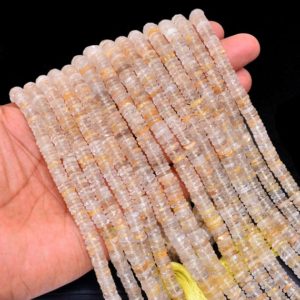 Shop Rutilated Quartz Faceted Beads! Gold Rutilated Quartz Faceted Heishi Beads | AAA+ Gemstone 4mm-8mm Tyre Rondelle 13inch Strand | Natural Golden Rutile Gemstone Coin Beads | Natural genuine faceted Rutilated Quartz beads for beading and jewelry making.  #jewelry #beads #beadedjewelry #diyjewelry #jewelrymaking #beadstore #beading #affiliate #ad