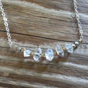 Shop Herkimer Diamond Necklaces! Herkimer diamond necklace with silver and gold | Natural genuine Herkimer Diamond necklaces. Buy crystal jewelry, handmade handcrafted artisan jewelry for women.  Unique handmade gift ideas. #jewelry #beadednecklaces #beadedjewelry #gift #shopping #handmadejewelry #fashion #style #product #necklaces #affiliate #ad