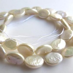 Shop Pearl Bead Shapes! White Fresh Water Flat Oval Shaped Pearl Beads, High Lustre Fancy Shaped Loose Pearls, 15 Inches, 11mm To 14mm Each, SKU-FP37 | Natural genuine other-shape Pearl beads for beading and jewelry making.  #jewelry #beads #beadedjewelry #diyjewelry #jewelrymaking #beadstore #beading #affiliate #ad