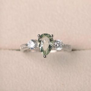 Shop Green Amethyst Jewelry! Natural green amethyst ring, wedding ring, pear cut gemstone, sterling silver ring, three stones ring | Natural genuine Green Amethyst jewelry. Buy handcrafted artisan wedding jewelry.  Unique handmade bridal jewelry gift ideas. #jewelry #beadedjewelry #gift #crystaljewelry #shopping #handmadejewelry #wedding #bridal #jewelry #affiliate #ad