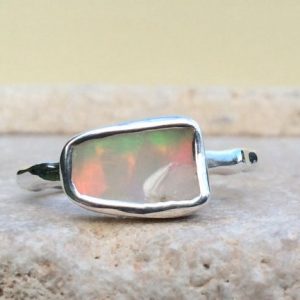 Shop Opal Rings! Raw Ethiopian Opal Silver Ring, Natural Gemstone Silver Ring, Mothers Day Gift | Natural genuine Opal rings, simple unique handcrafted gemstone rings. #rings #jewelry #shopping #gift #handmade #fashion #style #affiliate #ad