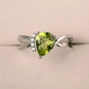 Shop Peridot Rings! Natural green peridot ring, promise ring, pear cut gemstone, August birthstone, sterling silver ring | Natural genuine Peridot rings, simple unique handcrafted gemstone rings. #rings #jewelry #shopping #gift #handmade #fashion #style #affiliate #ad