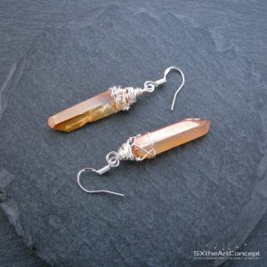 Shop Quartz Crystal Earrings! Tangerine Aura Quartz point earrings, raw dangling earrings, silver filled wire, Celestial boho women jewelry, gift for her | Natural genuine Quartz earrings. Buy crystal jewelry, handmade handcrafted artisan jewelry for women.  Unique handmade gift ideas. #jewelry #beadedearrings #beadedjewelry #gift #shopping #handmadejewelry #fashion #style #product #earrings #affiliate #ad