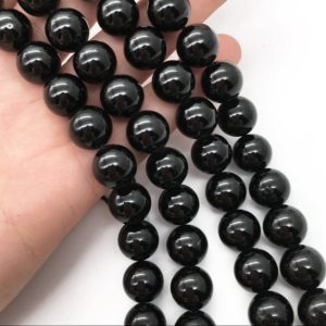 Shop Black Tourmaline Round Beads! 10mm Natural Black Tourmaline Beads, Round Gemstone Beads, Wholesale Beads | Natural genuine round Black Tourmaline beads for beading and jewelry making.  #jewelry #beads #beadedjewelry #diyjewelry #jewelrymaking #beadstore #beading #affiliate #ad