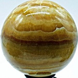 Shop Calcite Shapes! Banded Amber Calcite Sphere 5.6" in Diameter 9.38 pounds | Natural genuine stones & crystals in various shapes & sizes. Buy raw cut, tumbled, or polished gemstones for making jewelry or crystal healing energy vibration raising reiki stones. #crystals #gemstones #crystalhealing #crystalsandgemstones #energyhealing #affiliate #ad