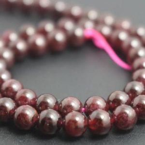 6mm Natural Garnet Beads,Smooth and Round Garnet Beads,15 inches one starand | Natural genuine round Garnet beads for beading and jewelry making.  #jewelry #beads #beadedjewelry #diyjewelry #jewelrymaking #beadstore #beading #affiliate #ad