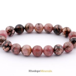 Shop Rhodonite Bracelets! Rhodonite Bracelet, Rhodonite Bracelet 10 mm Beads, Rhodonite Bracelet, Rhodonite, Crystals, Rocks, Stones, Gifts, Metaphysical Crystals | Natural genuine Rhodonite bracelets. Buy crystal jewelry, handmade handcrafted artisan jewelry for women.  Unique handmade gift ideas. #jewelry #beadedbracelets #beadedjewelry #gift #shopping #handmadejewelry #fashion #style #product #bracelets #affiliate #ad