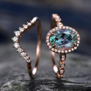 Shop Alexandrite Rings! 2pcs Alexandrite bridal set color change Alexandrite engagement ring set rose gold marquise diamond halo moissanite crown wedding ring band | Natural genuine Alexandrite rings, simple unique alternative gemstone engagement rings. #rings #jewelry #bridal #wedding #jewelryaccessories #engagementrings #weddingideas #affiliate #ad